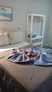 En eller flere senge i et værelse på Lotf Romântico/com Ar Privativo