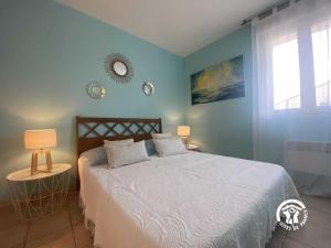 En eller flere senge i et værelse på Le cedre du parc de la dame