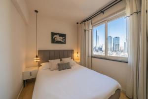 Giường trong phòng chung tại Tonight Homestay East Nanjing Road Shanghai