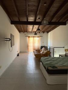 En eller flere senge i et værelse på Almafuerte Centro