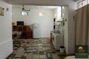 a kitchen with two refrigerators and a table in it at Casa El Chaparral Villa Dolores, Traslasierra 3 in Piedra Pintada