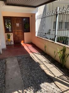 a front door of a house with a porch at Casa de Gregorio Hostel in Córdoba +10 photos