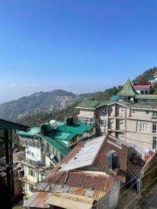 an overhead view of a city with buildings at Cloudscape Cottage in Shimla