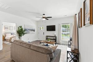 a living room with a couch and a bed at Heart of Cedartown | 0.3 miles from the Silver Comet Trail in Cedartown