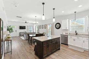 a kitchen and living room with a table and chairs at Heart of Cedartown | 0.3 miles from the Silver Comet Trail in Cedartown
