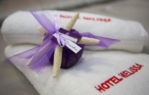 a pair of cinnamon sticks sitting on top of a towel at Boutique Hotel Melissa in Poreč