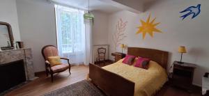 a bedroom with a bed and a star on the wall at Maison boutet 9 in Fanjeaux