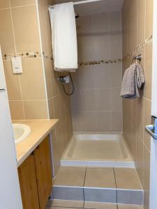 a bathroom with a tub and a sink at 92 Blueberry Lodge - Sea Views in Westward Ho