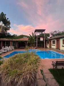 a villa with a swimming pool and a house at Pousada em Itupeva in Itupeva +9 photos