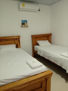 En eller flere senge i et værelse på Casa Isabel