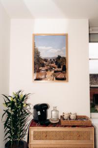 a picture hanging on a wall above a table at Maison Le Catelier in Le Catelier +25 photos