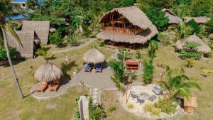 a model of a house with a straw roof at Tongo Hill Cottages in Moalboal