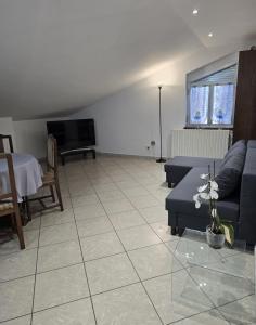 a living room with a couch and a tv at Mely House centralissimo in Castel di Sangro
