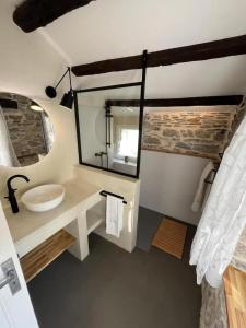 a bathroom with a sink and a mirror at Calouze in Gijounet
