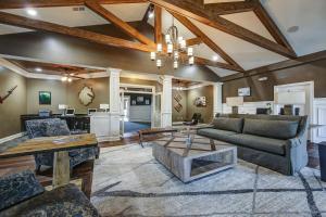 a living room with a couch and a table at Landing Beautiful 3BD Clubhouse Pool in Greer +26 photos
