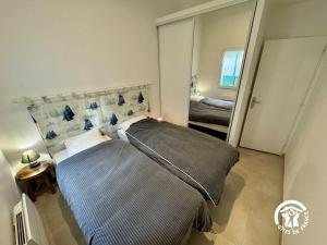 En eller flere senge i et værelse på La maisonnette