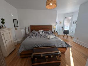 En eller flere senge i et værelse på Le Namasté Auberge touristique