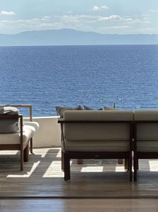 a balcony with a view of the ocean at Sea Horizon Private Villa with Panoramic Sea Views in Nea Skioni