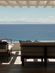 a living room with a view of the ocean at Sea Horizon Private Villa with Panoramic Sea Views in Nea Skioni
