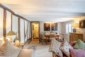 a living room with a table and a dining room at 2 Bed in Dedham oc-c32543 in Dedham