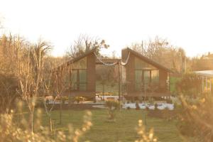 a house with a garden in front of it at Our village in Khoni