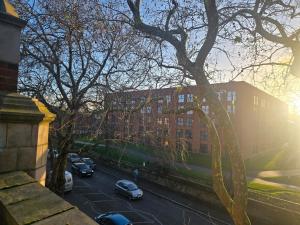 a view of a street with cars parked in a parking lot at 1 Bed City Centre Apartment in Derby