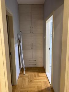 a room with a closet and a wooden floor at Vila Ljubovic in Podgorica