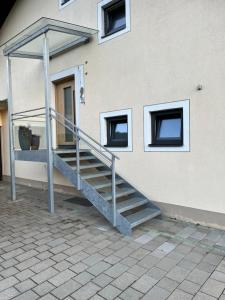a set of stairs in front of a building at Bergkraft in Assling +5 photos