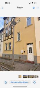 a building with a light pole in front of it at Mathilde in Quedlinburg +7 photos