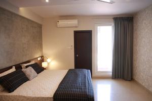 En eller flere senge i et værelse på Oris Brookefield