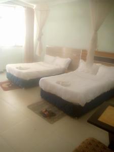 two beds sitting on the floor in a room at Dagmaros in Bahir Dar