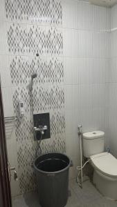a bathroom with a bath tub next to a toilet at Aby's Guest House in Tlekung +11 photos