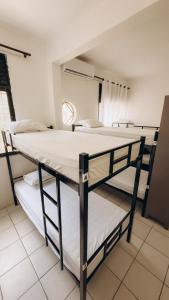 Postel nebo postele na pokoji v ubytování Hostel Barra 163