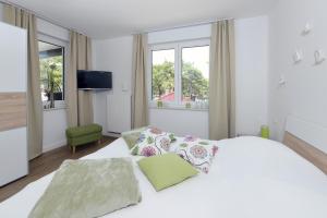 Postel nebo postele na pokoji v ubytování Ferienwohnung Sonnensegler