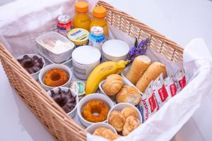 a basket filled with different types of food and drinks at Solena Hotel in Camburi