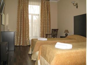 Postel nebo postele na pokoji v ubytování Admiral Hotel + 37 fotografií