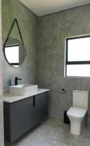 Et badeværelse på Mupauli Boutique Lodge