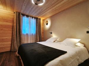 Giường trong phòng chung tại Chalet prestige 14 pers au pied des pistes