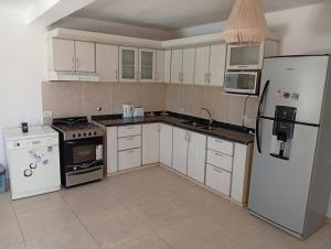 Køkken eller tekøkken på Hermosa casa a 15 min de Villa Carlos Paz