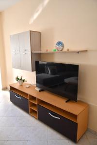 a living room with a large flat screen tv at Coastal Calm in Golem
