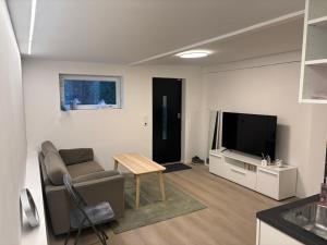 Et tv og/eller underholdning på Family friendly apartment with parking