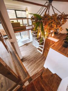 a view from the top of a room with wood floors at NorAtlas Heritage - Adults Only in Varlămul +21 photos