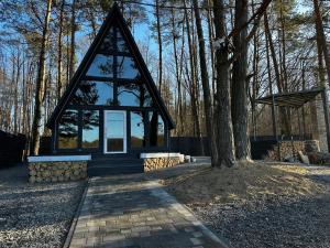 a small house in the middle of a forest at A-frame будиночок in Staraya Guta