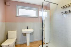 a bathroom with a toilet and a sink and a window at 2 Bed in Lowick oc-c34008 in Lowick