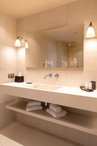 a bathroom with a large sink and a mirror at Boutique hôtel Château Rouher in Propriano +87 photos