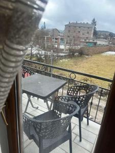 a balcony with a table and chairs on a balcony at Castle Rozafa Scutari in Voskopojë +11 photos
