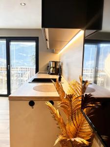 a kitchen with a island with a counter top at Residence Pranterhof in Marlengo +114 photos