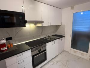 Køkken eller tekøkken på Residence Vacanza Torre Montecarlo