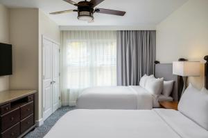 a hotel room with two beds and a television at Marriott's StreamSide Evergreen at Vail in Vail +36 photos