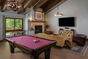 a living room with a pool table at Marriott's StreamSide Evergreen at Vail in Vail